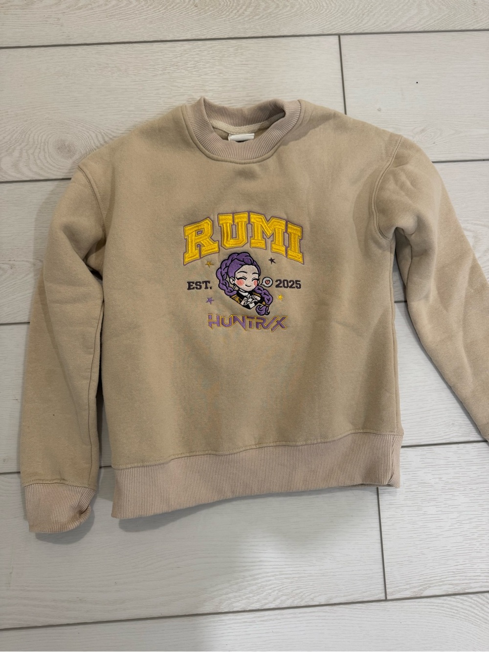 RUMI K POP Demon Hunters Embroidered Sweatshirt in Tan Youth S